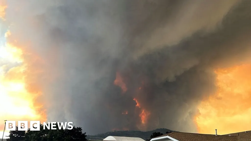 Fast-moving Canada wildfire doubles in size forcing thousands to flee homes