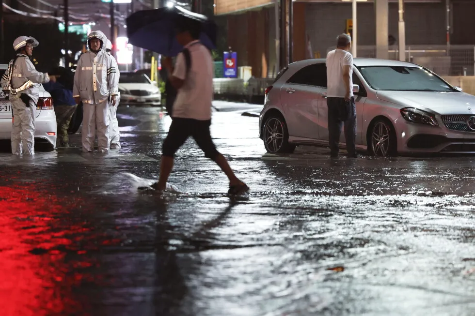 Torrential rain near Tokyo causes flooding and paralyzes traffic, killing 1