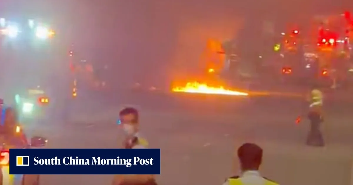 Truck driver flees after vehicle crashes and bursts into flames on Lantau highway
