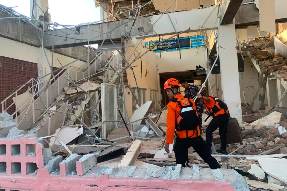 Rescuers dig through rubble and landslides after Indonesia quake kills 47