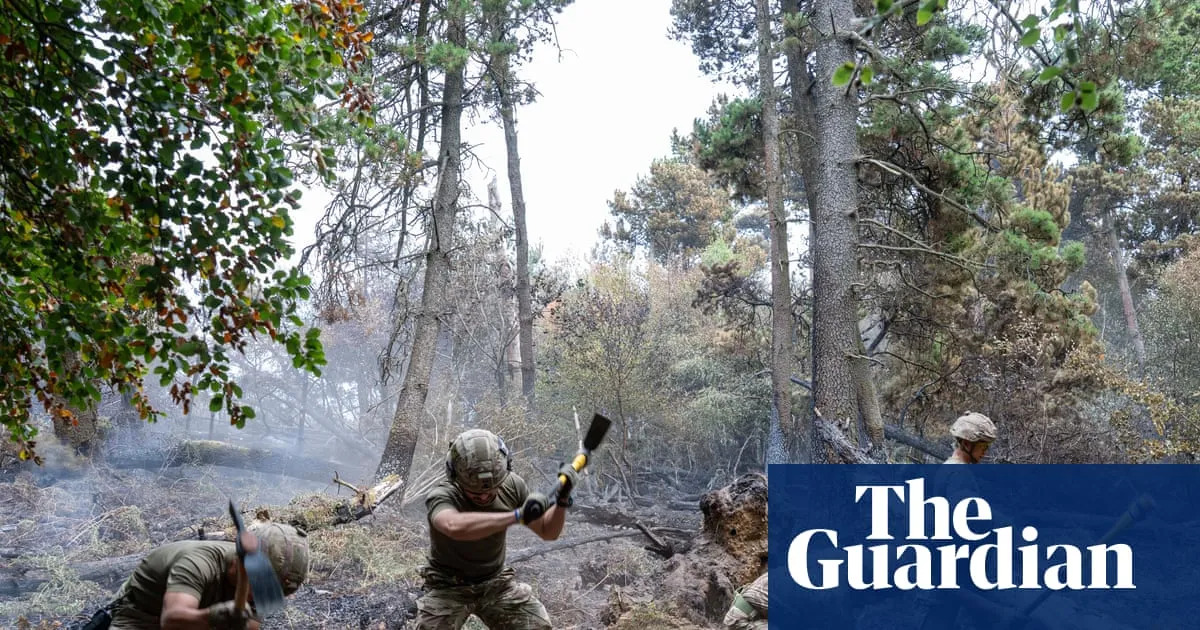 ‘It’s been very tough’: hope of progress in gruelling battle against south Wales wildfire