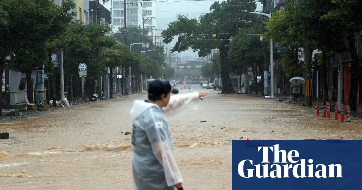 Torrential rains kill one in South Korea while Philippine capital battles major flooding