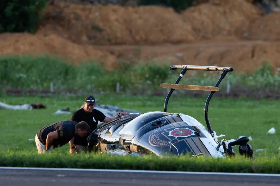 Investigators probe a dramatic midair crash as a landing plane hits hovering police helicopter
