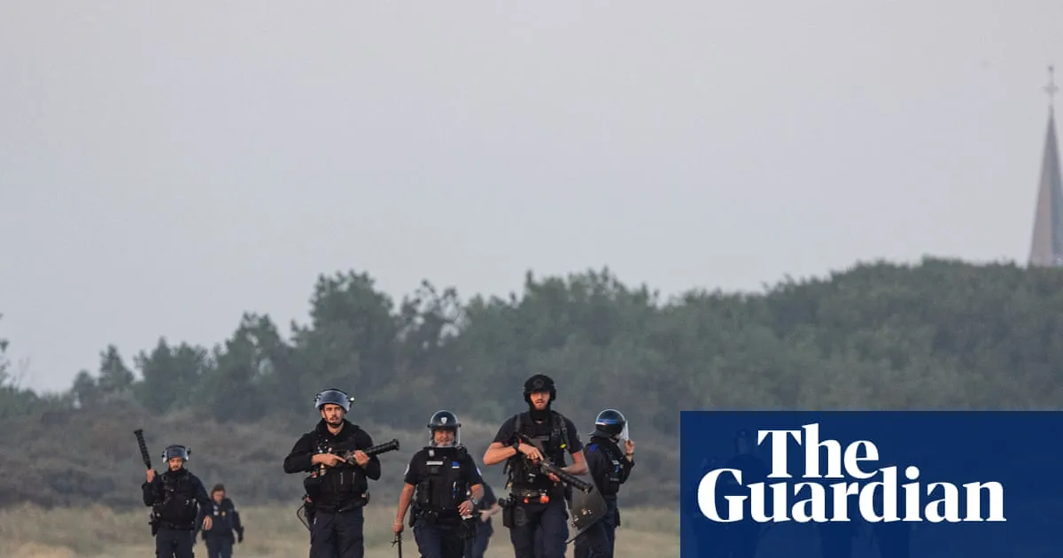 Footage shows clash with French police on beach as dinghy tries to leave for UK