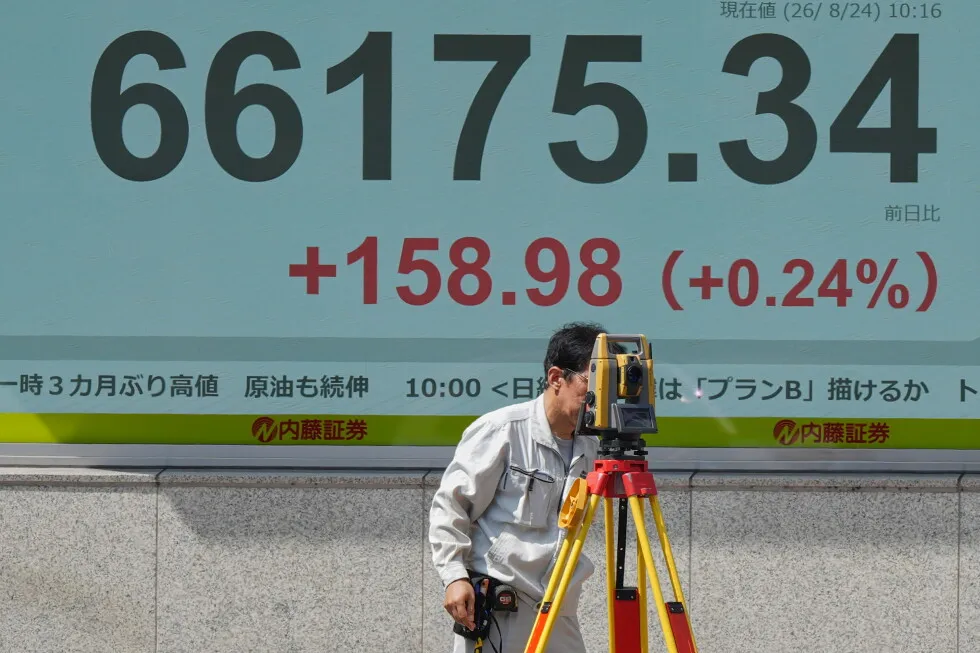 Asian shares are mixed and oil prices hold steady as the US raises pressure on Iran