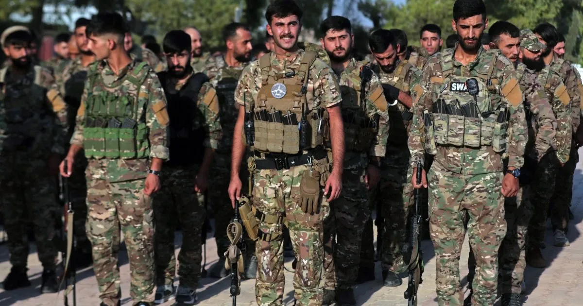 Kurdish-led forces in Syria dissolve after merging with army
