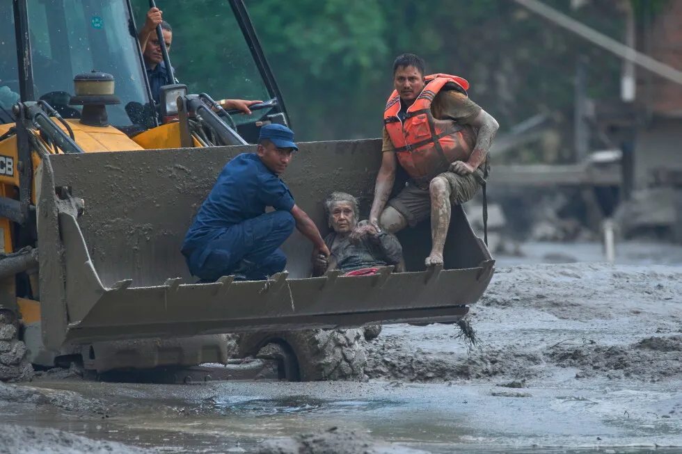 Hundreds missing and at least 8 killed after avalanche triggers deadly flash floods in Nepal