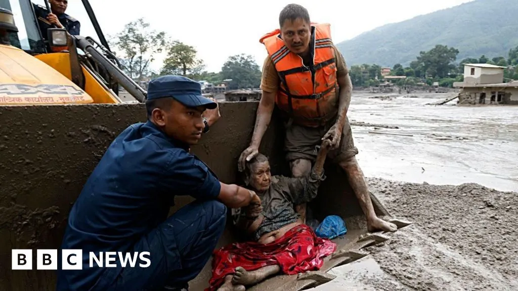 People pulled from mud in Nepal after deadly flash floods