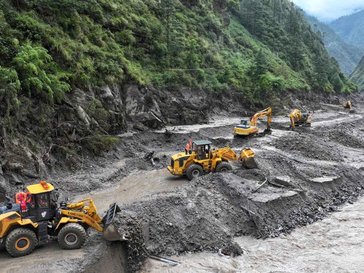 Nepal and China halt rescue efforts as border barrier lake overflows