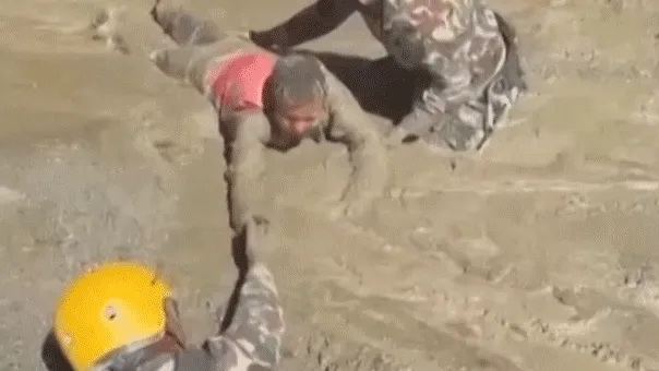 Trapped Nepali workers pulled from hydropower tunnel after catastrophic flooding