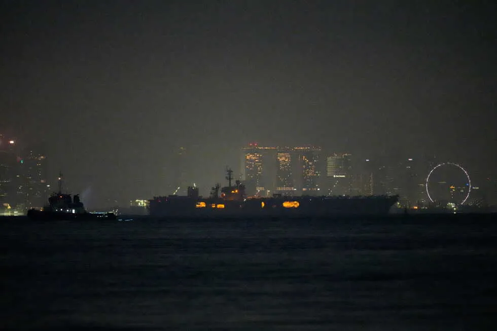 USS Abraham Lincoln sails past Singapore on its way home from Middle East