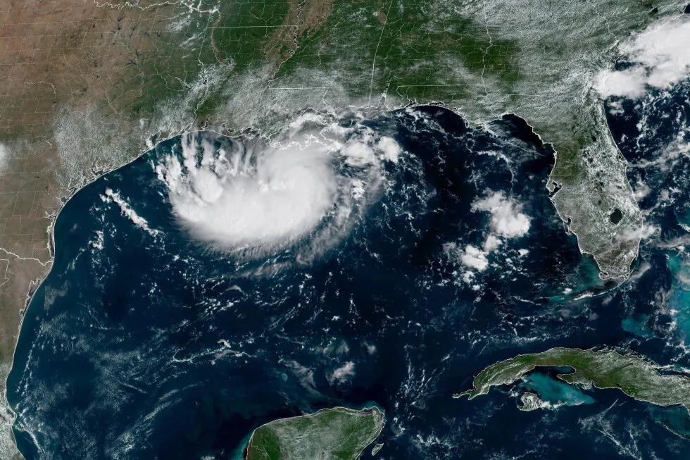 Tropical Storm Edouard heads for Texas and Louisiana while a storm moves toward Hawaii