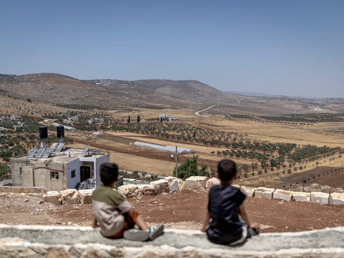 Two Palestinians killed as settlers, Israeli forces raid West Bank village