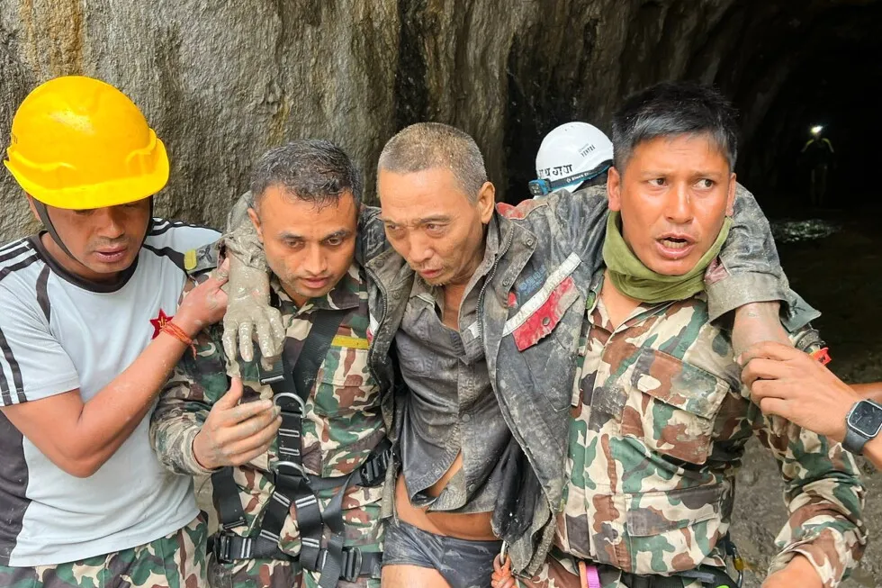 Rescuers in Nepal pull a Chinese national alive from a hydropower tunnel 10 days after floods