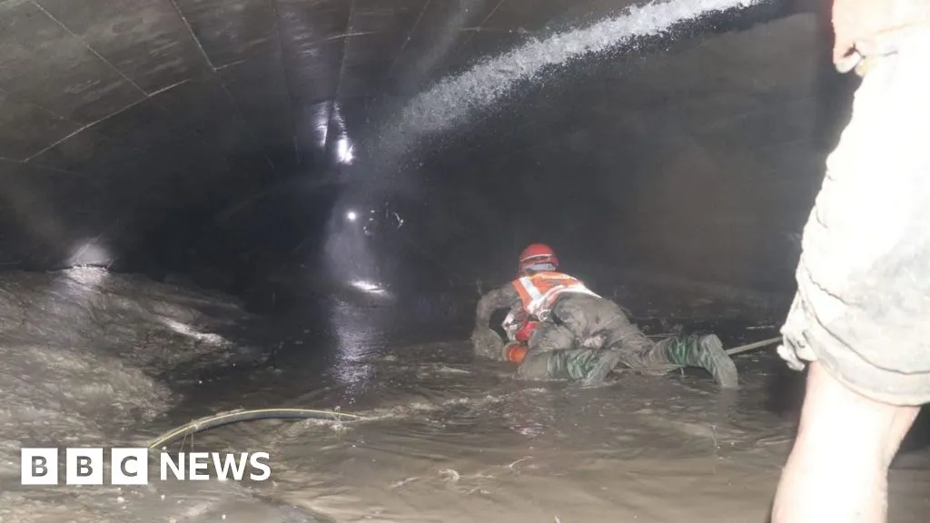 Nepal rescuers try to reach dozens trapped in tunnel after two found alive