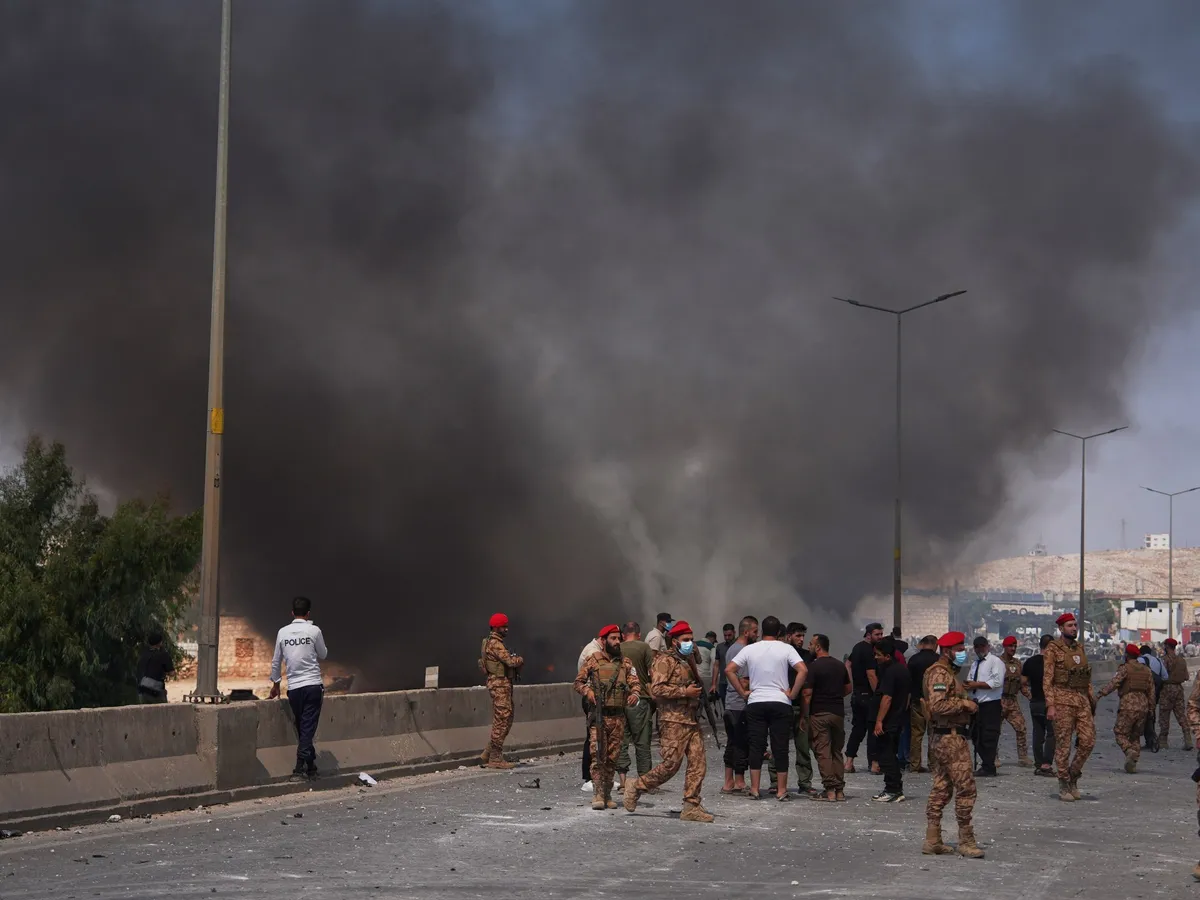 At least 14 killed in weapons depot blast in Syria’s Idlib, state TV says