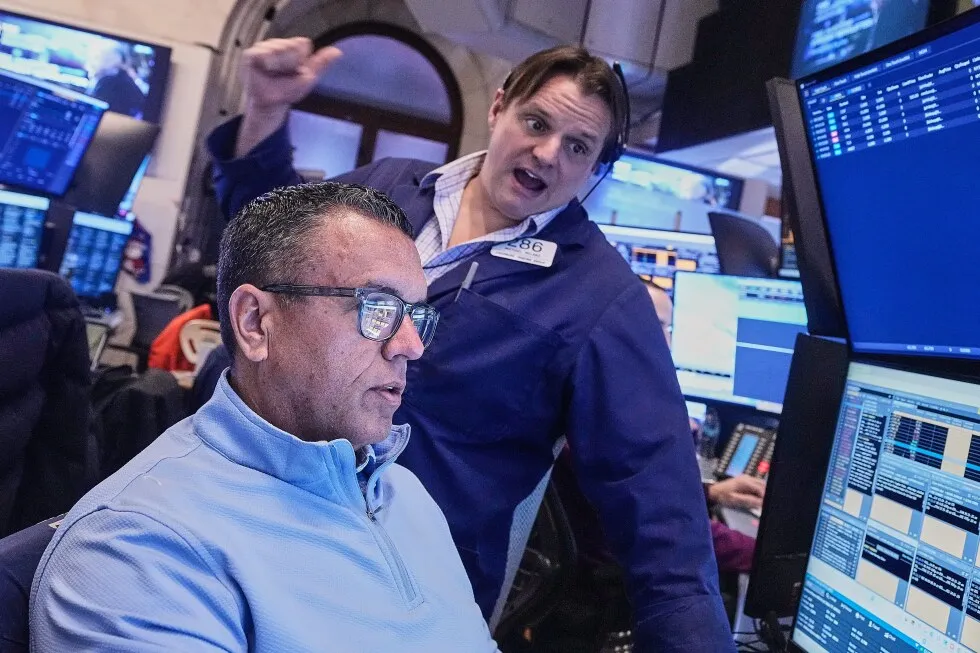 Stocks zigzag on Wall Street following mixed profit reports from UnitedHealth, GM and others