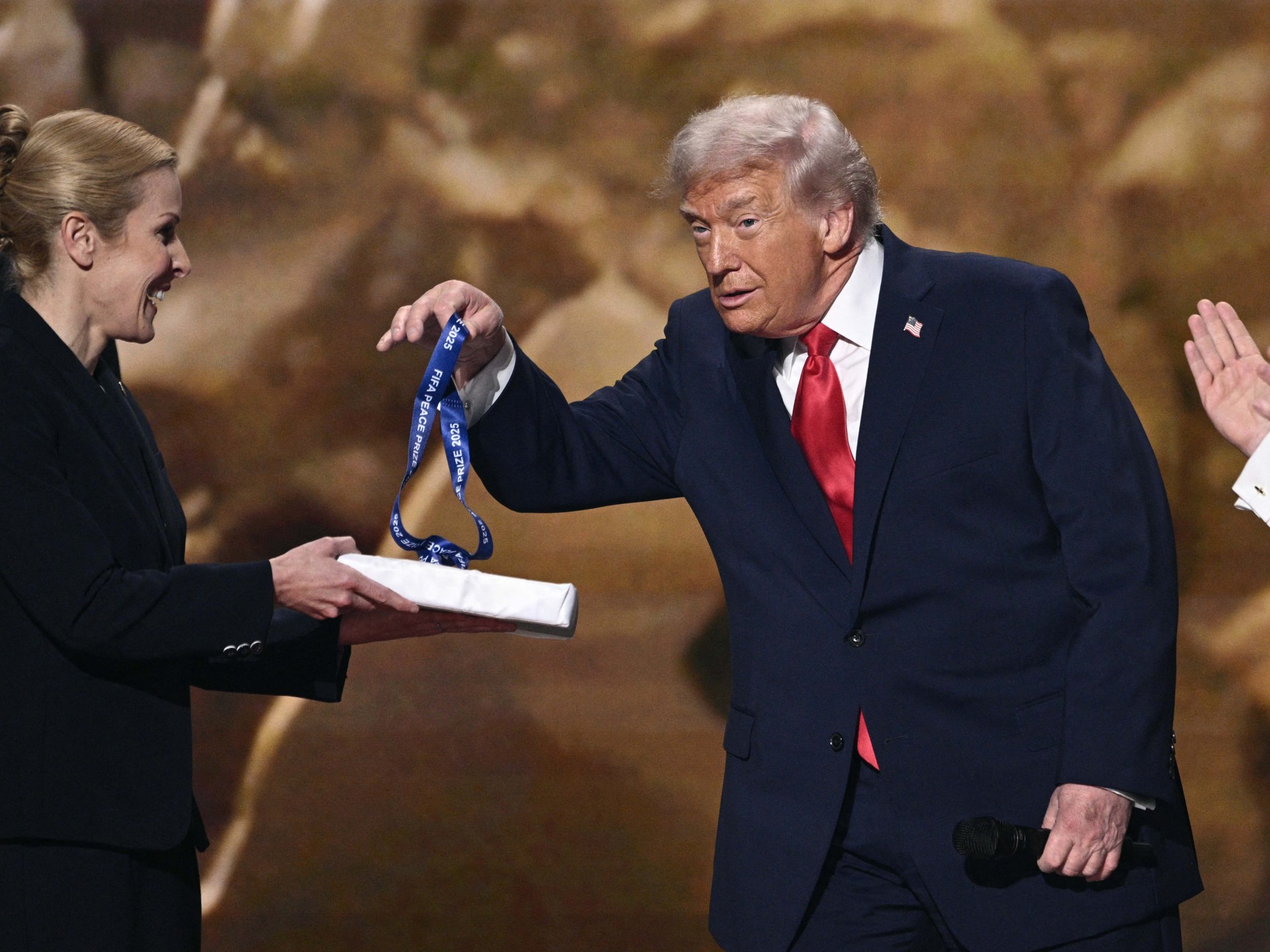 Trump takes the spotlight, Peace Prize at FIFA World Cup Draw