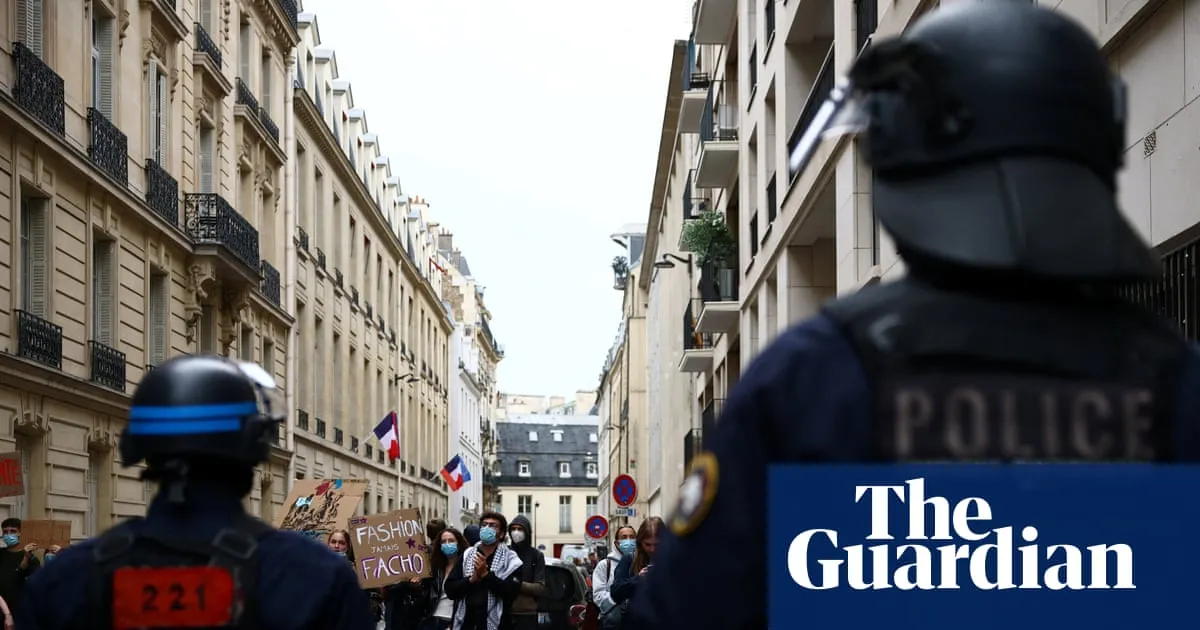 French police suspend use of stun grenades after high-school protester loses hand