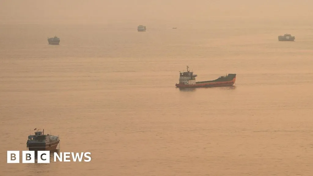 Container ship hit by projectile sinks in Strait of Hormuz, Singapore says