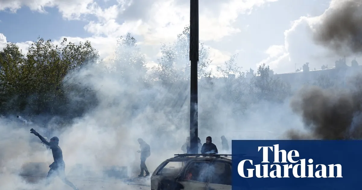Police clash with protesters as tens of thousands take to streets across France