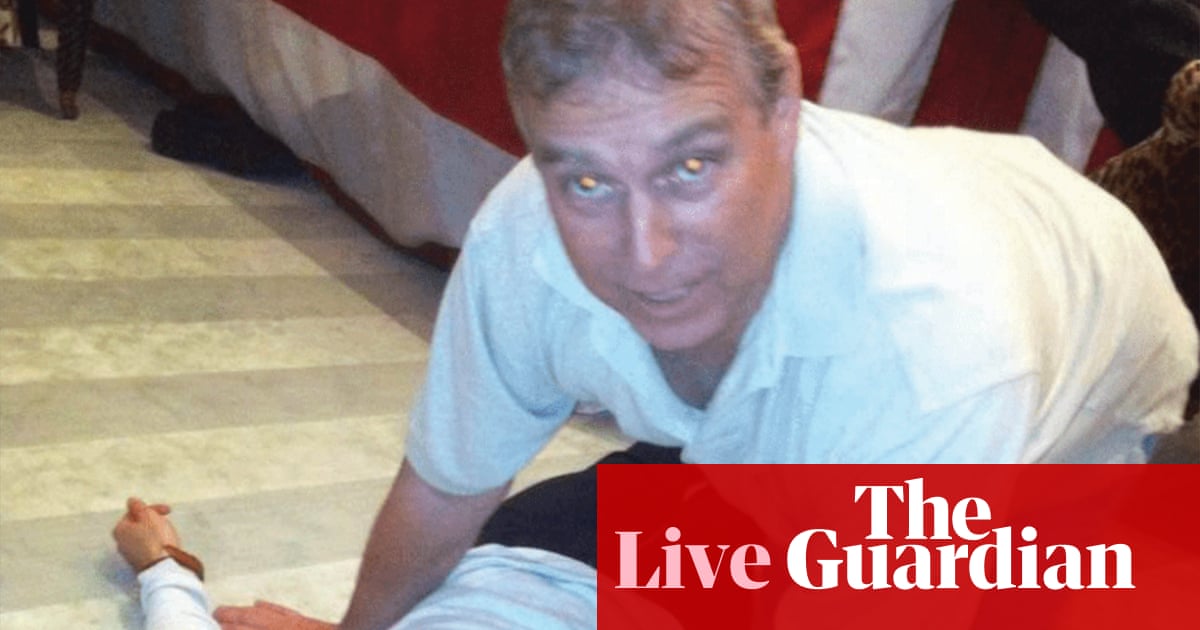 Epstein files latest: photos appear to show former prince Andrew crouching over woman