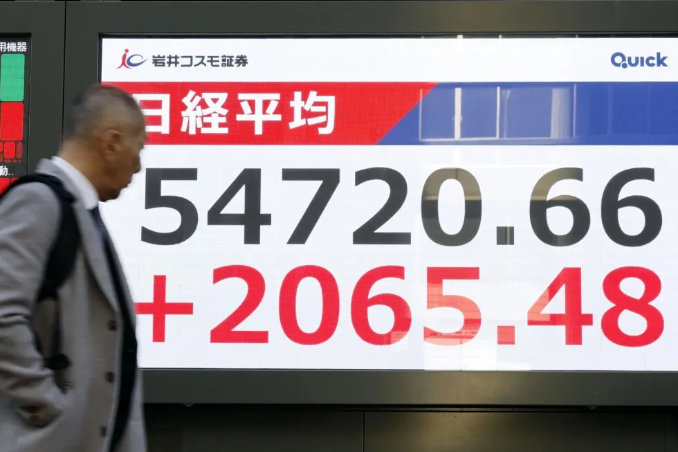 Asian shares surge, led by records in Japan and South Korea, as markets regain momentum
