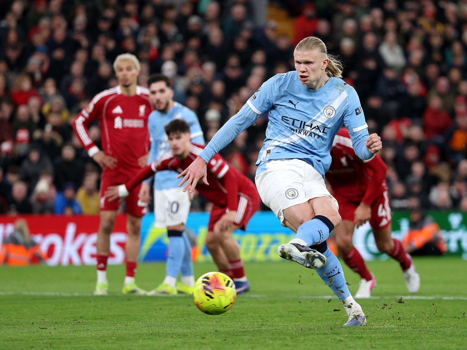 Man City fight back to win 2-1 at Liverpool and keep title hopes alive