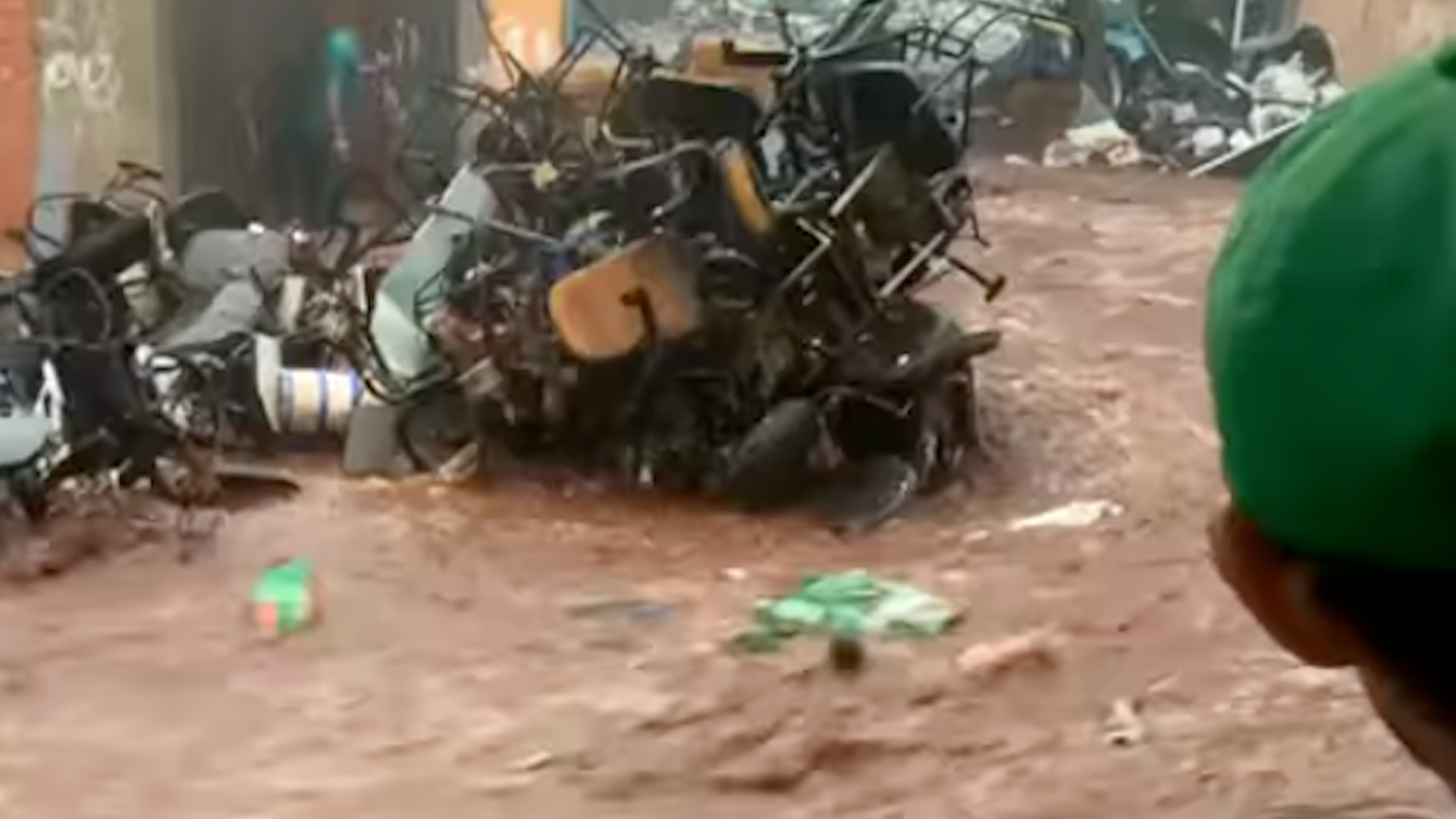 Video: Brazil floods send torrent of waste down street