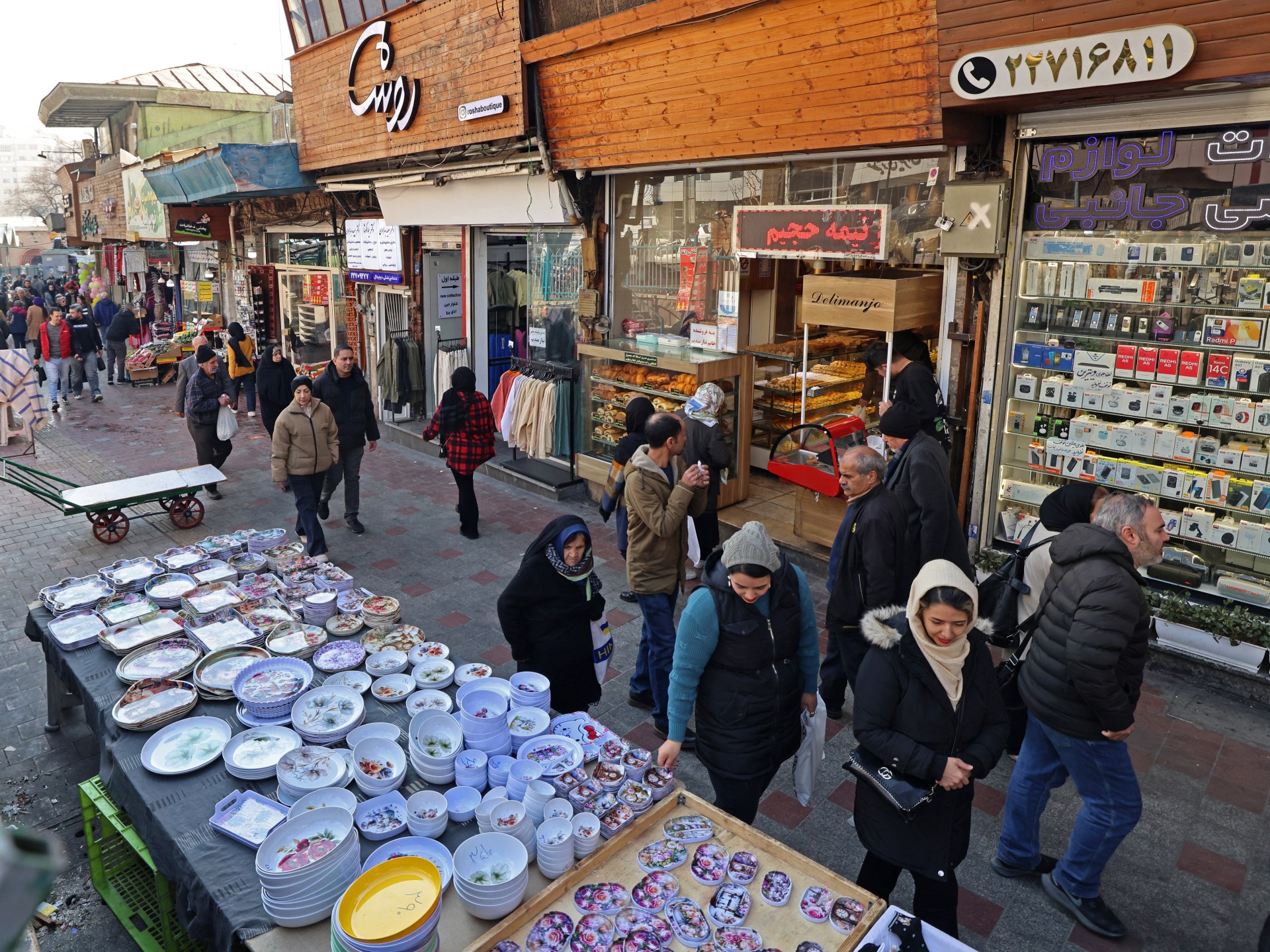 Iran shuts down private businesses after protests as economy slumps
