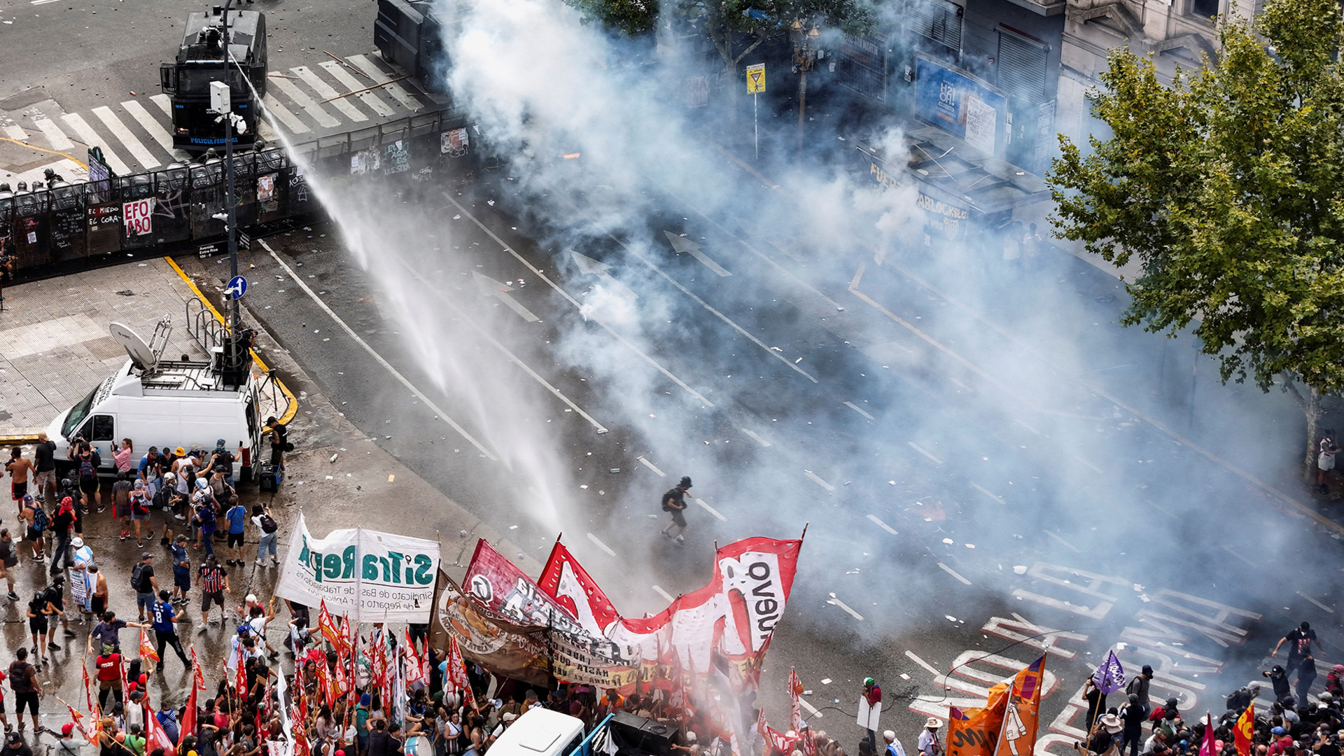 Argentinian security forces fire water cannon and tear gas at protesters