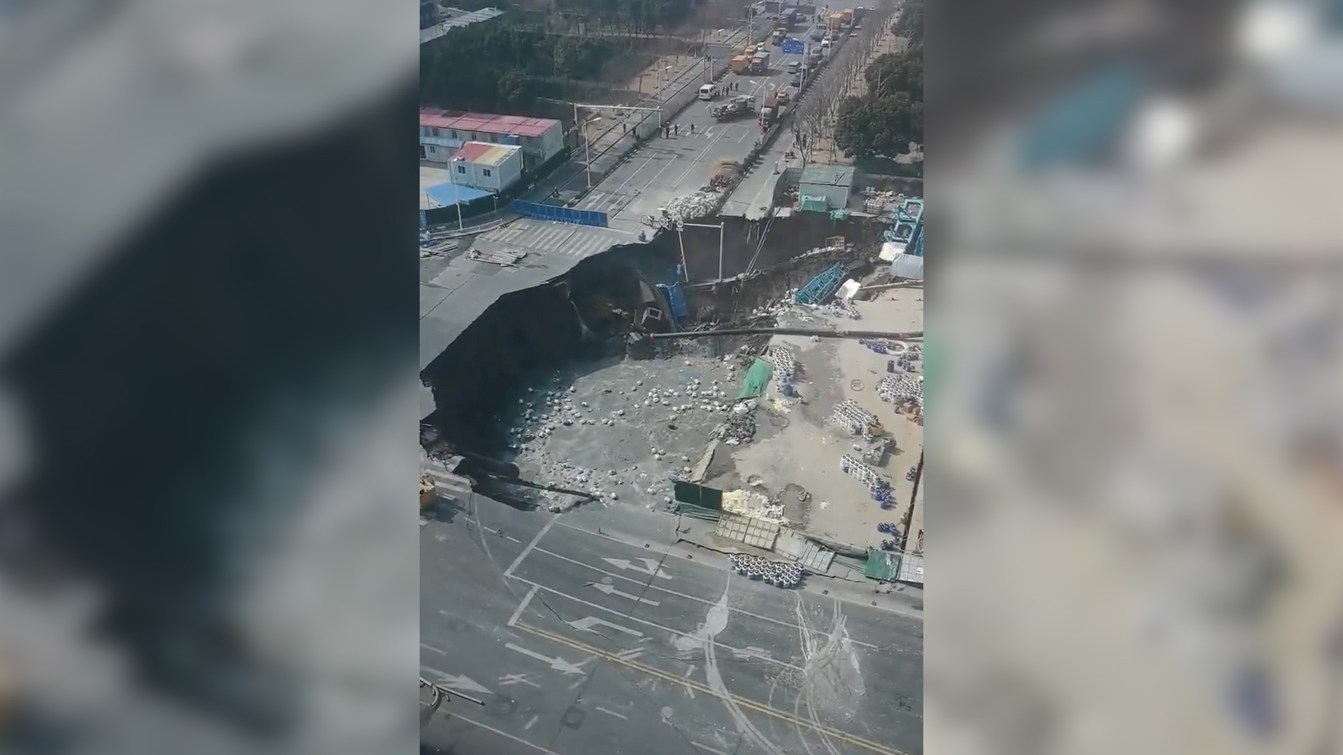 CCTV video captures moment sinkhole swallows road in Shanghai