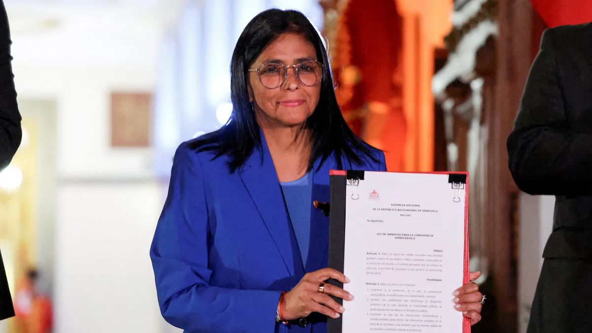 Venezuela signs amnesty law as families await prison releases