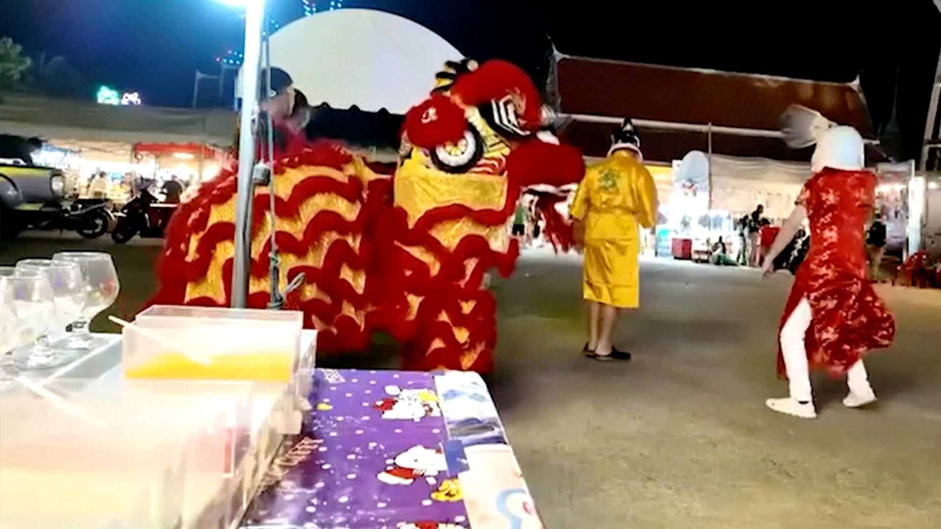Thai police disguised in dancing lion costume arrest wanted man