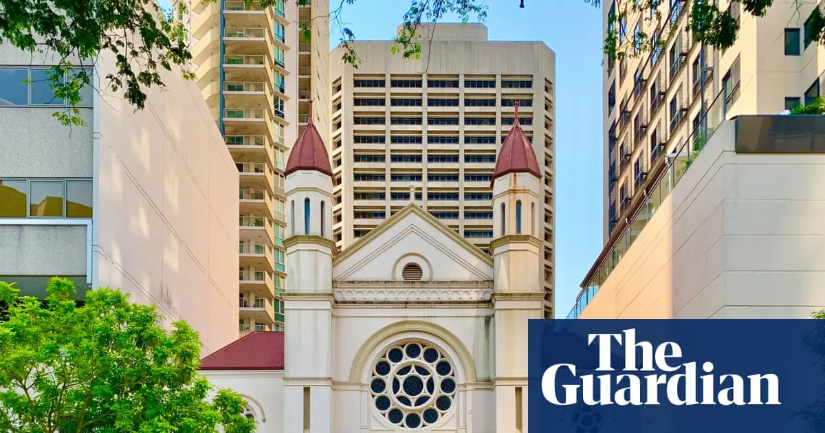 Man charged with hate crime after allegedly ramming gates of Brisbane synagogue with ute