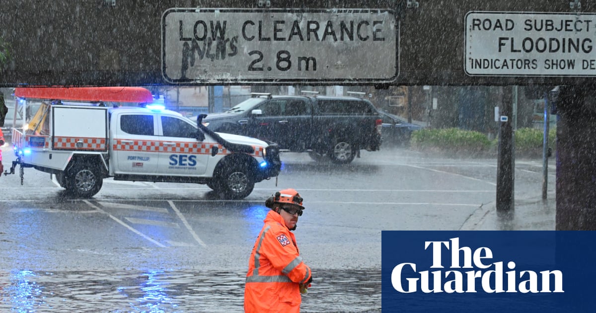 Last of the summer rain puts southern states on flood watch and Sydney on alert for bull sharks