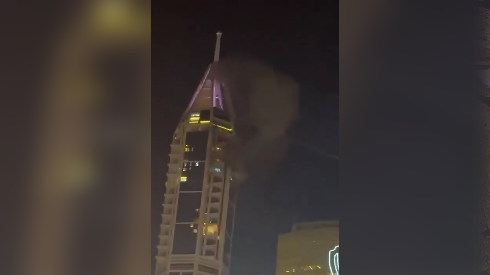 Smoke rises from a Dubai tower after attack