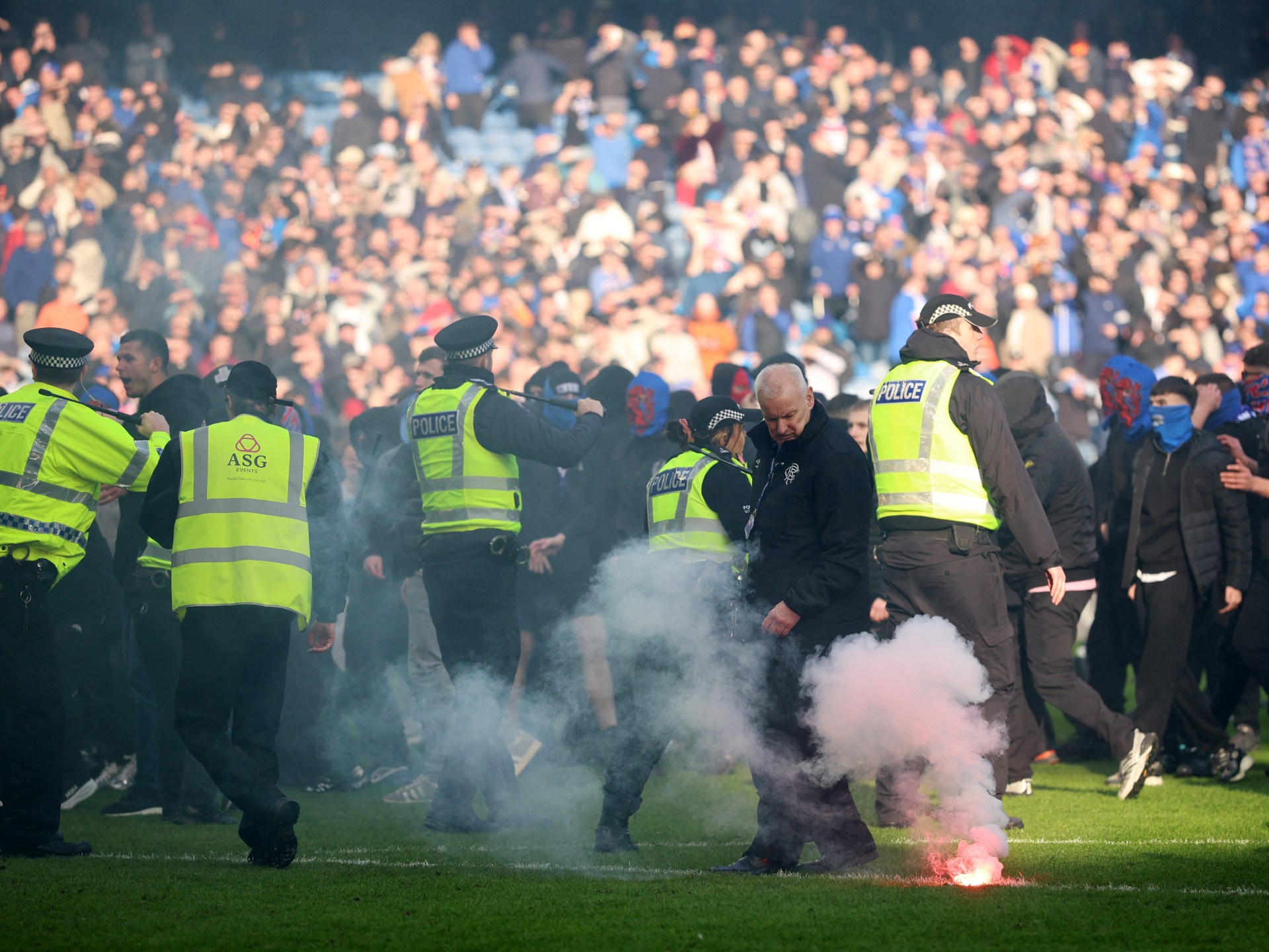 Rangers vs Celtic turns ugly as fans clash on pitch after Scottish Cup tie