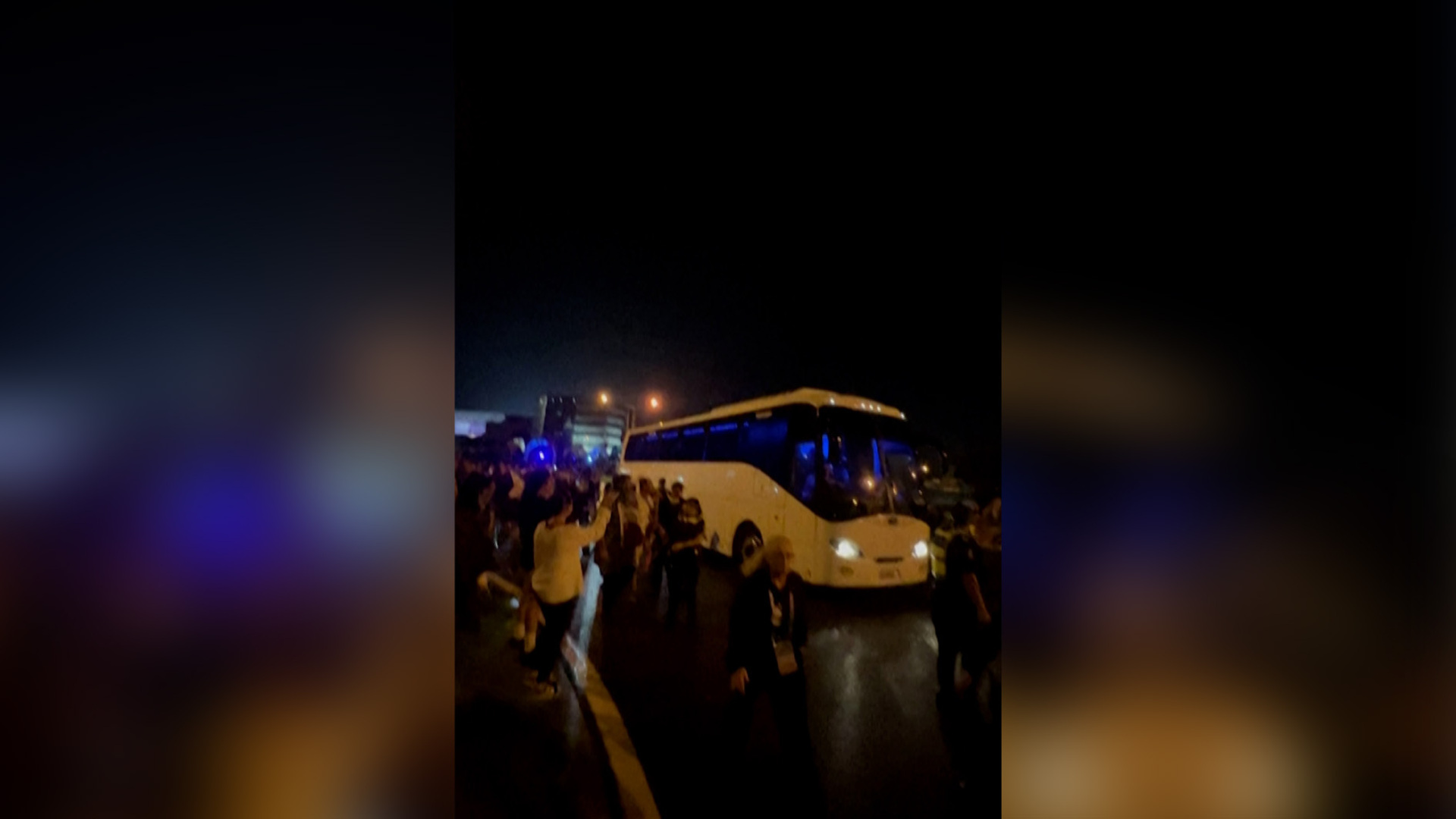 Crowd chants ‘save our girls’ at bus carrying Iran women’s team