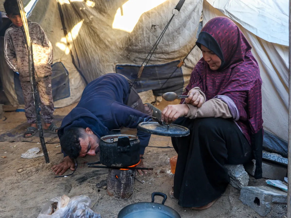 ‘Life covered in soot’: Gas shortage forces Gaza families to cook over wood