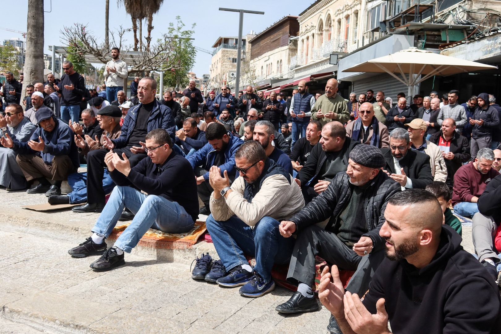 Worshippers pray outside Al-Aqsa amid closure on al-Quds Day