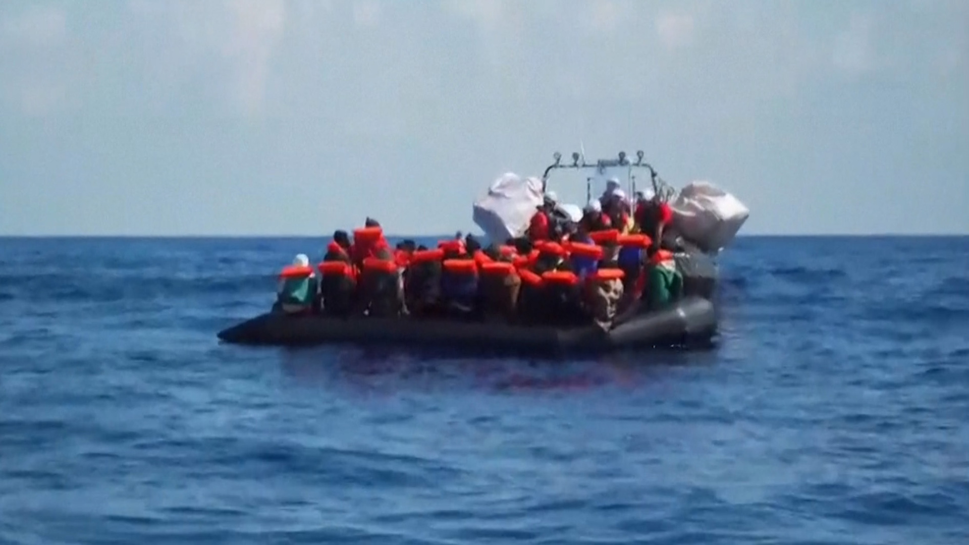 Video shows dozens of migrants being rescued in the Mediterranean Sea
