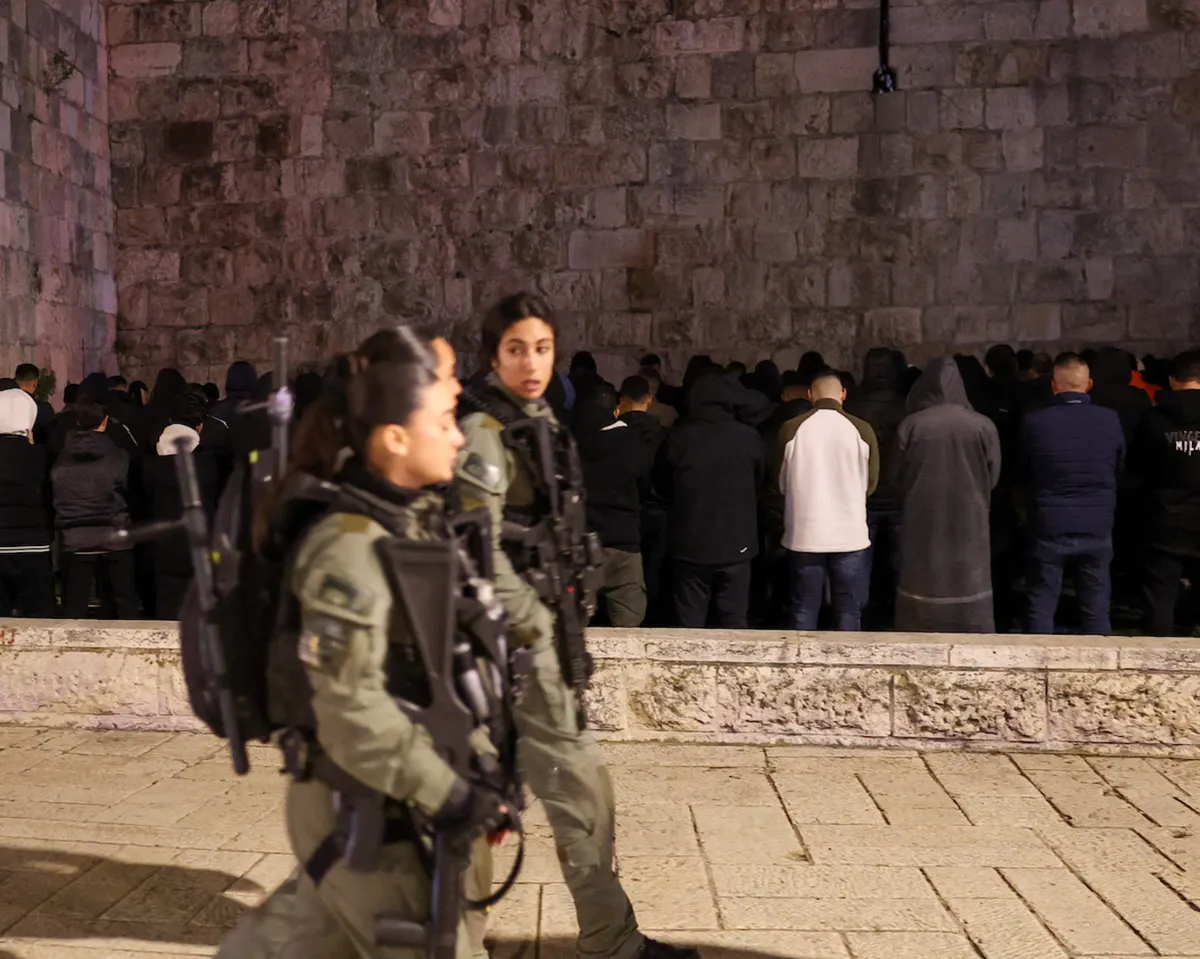 Muslims pray near closed Al-Aqsa Mosque on Ramadan holy night