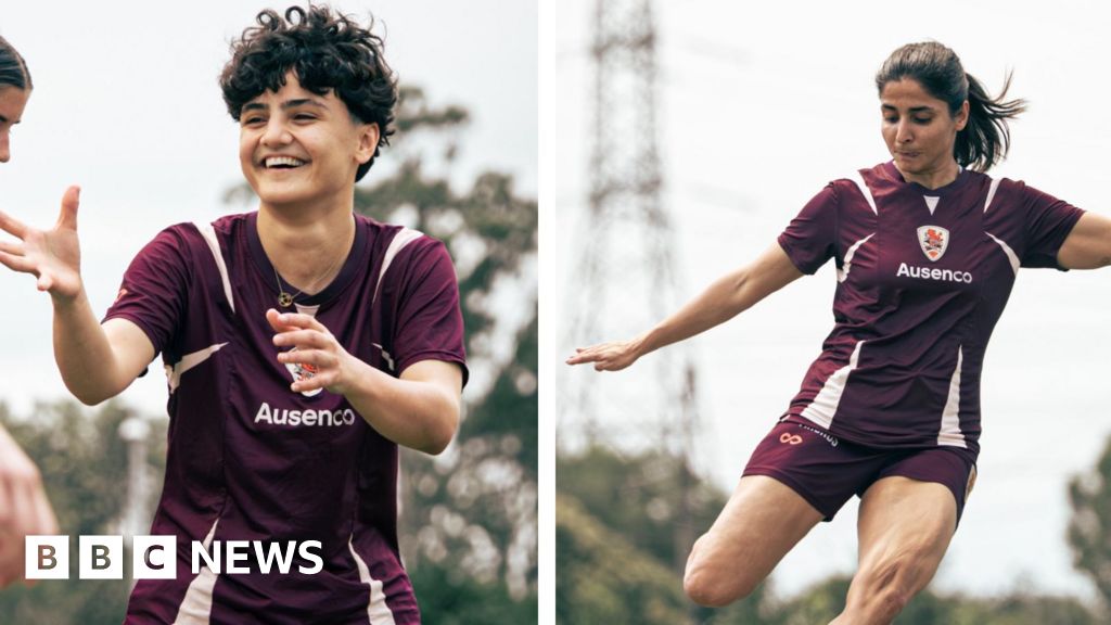 Why did only two Iranian football players stay in Australia?