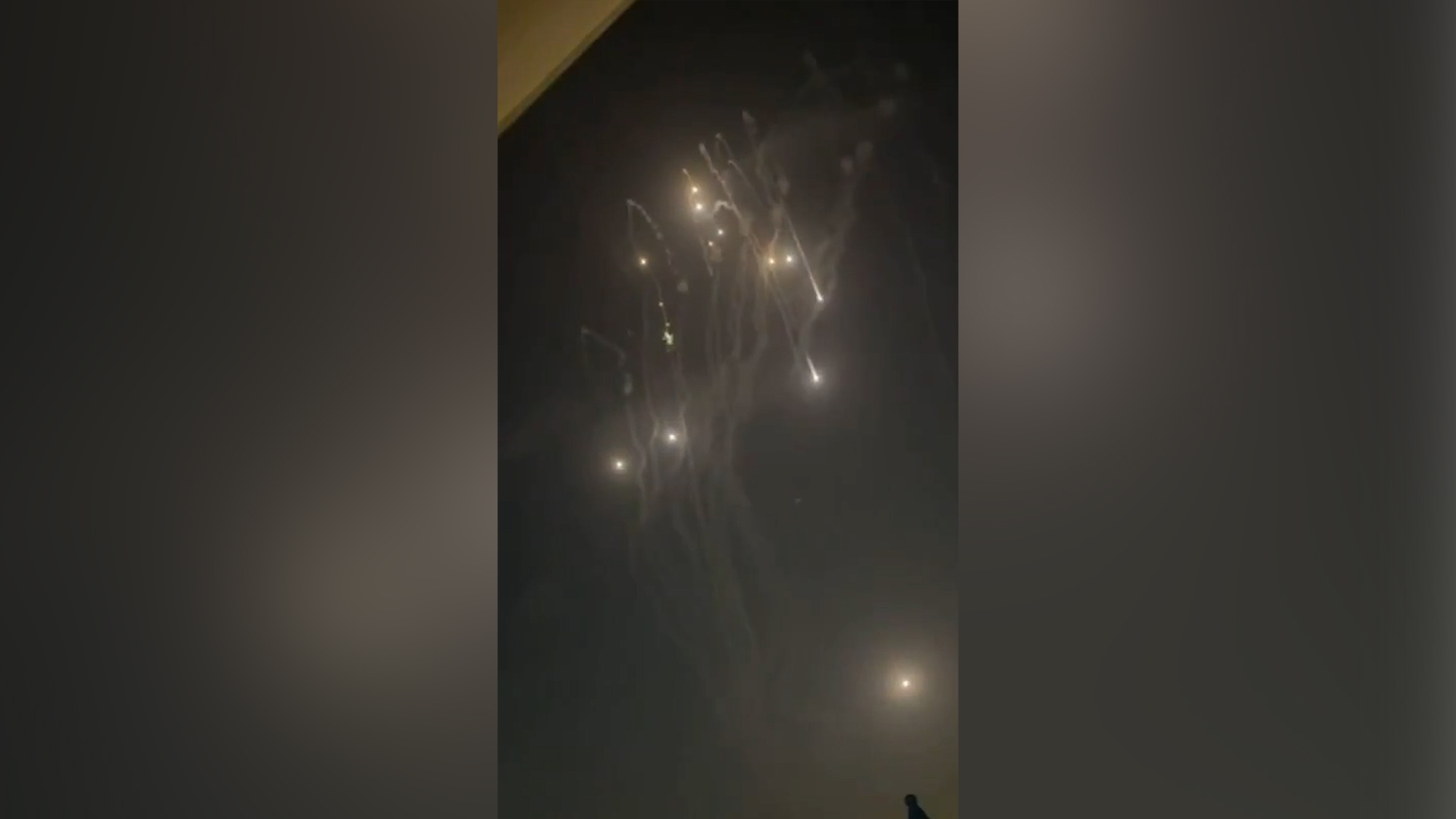 Burning debris from missile interceptions showers Dubai
