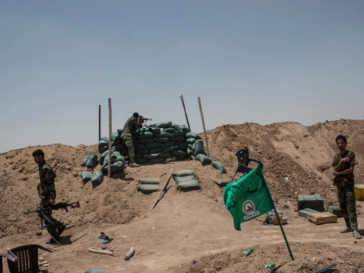 Strikes kill two PMF fighters in northern Iraq amid wider war, group says