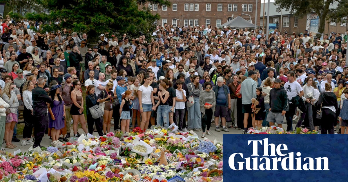 Met with a scene of horror at Bondi beach, strangers embraced, shed tears and gathered in silence