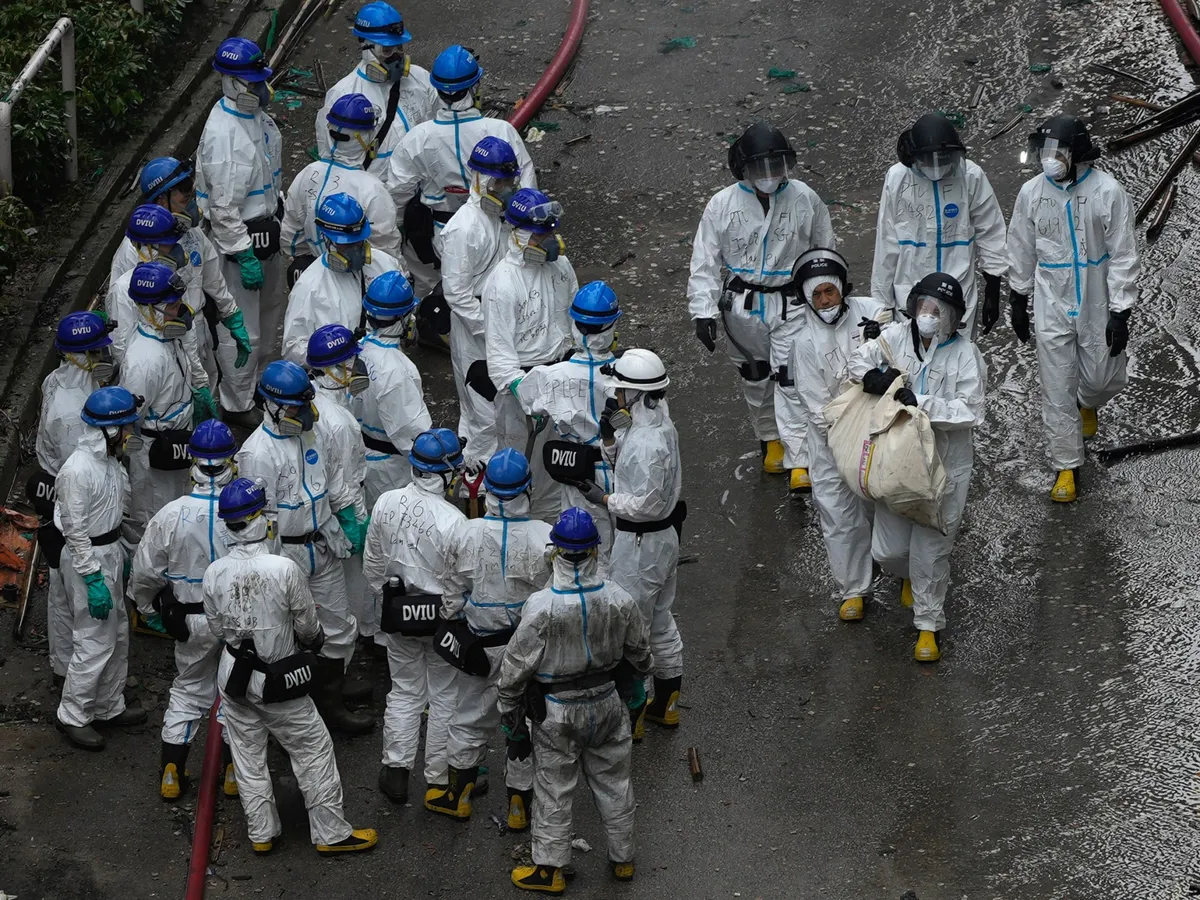 Death toll in Hong Kong apartment complex fire hits 146