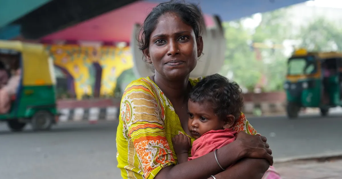 ‘I count their breaths’: A homeless mother protects her children in Delhi
