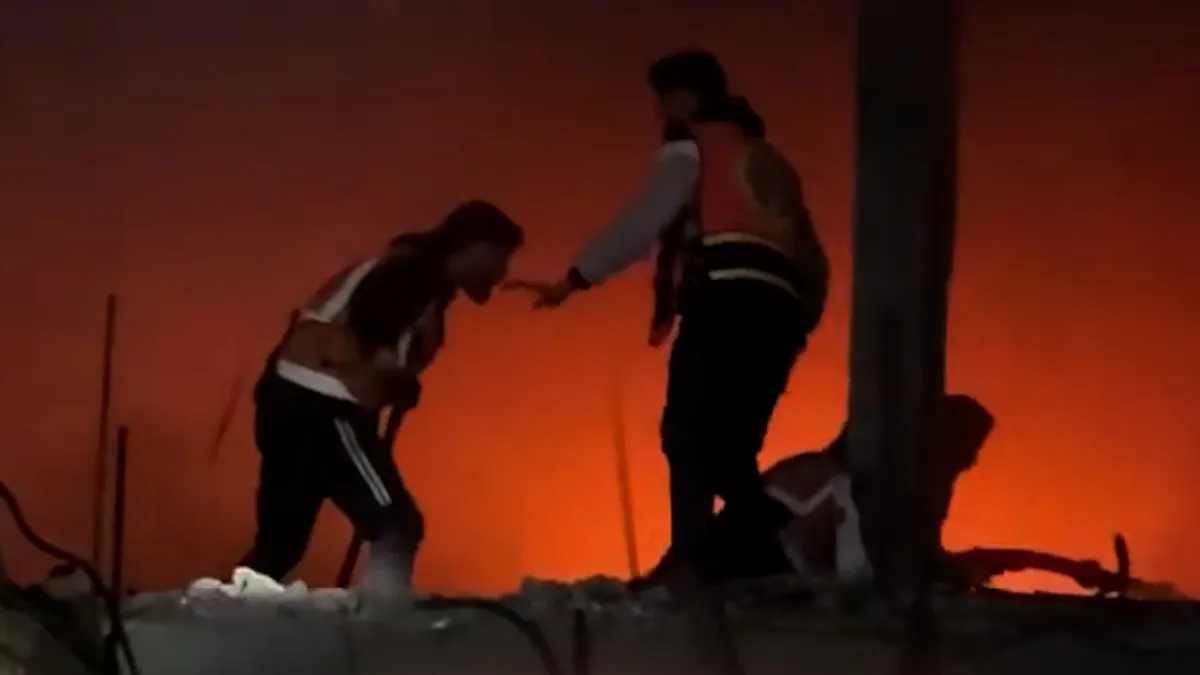 Rescue teams brave fire in suspected attack on Gaza City residential area